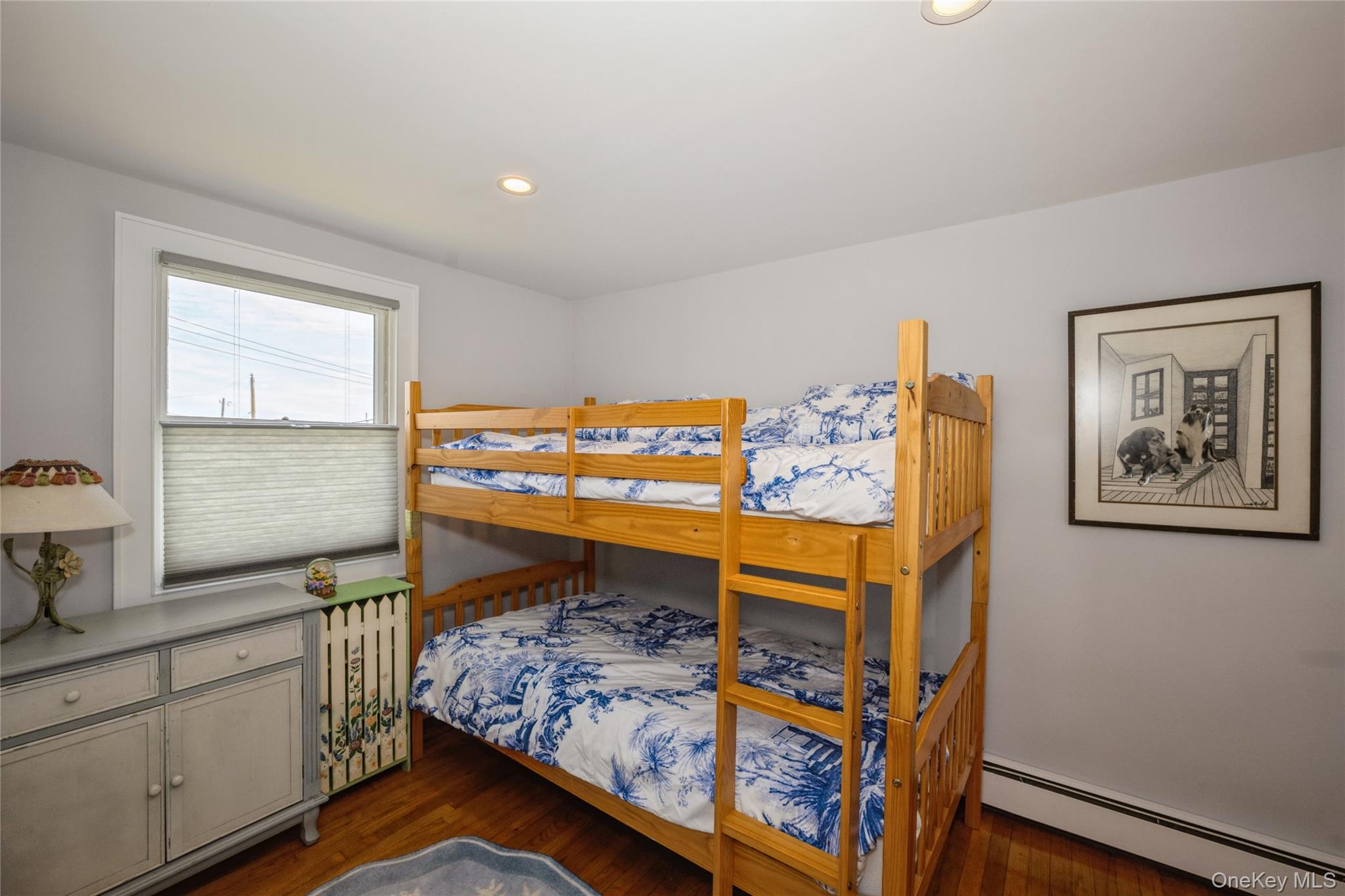 155 Essex Street Montauk, NY 11954 - Photo 8 of 11 a bed room with furniture and window