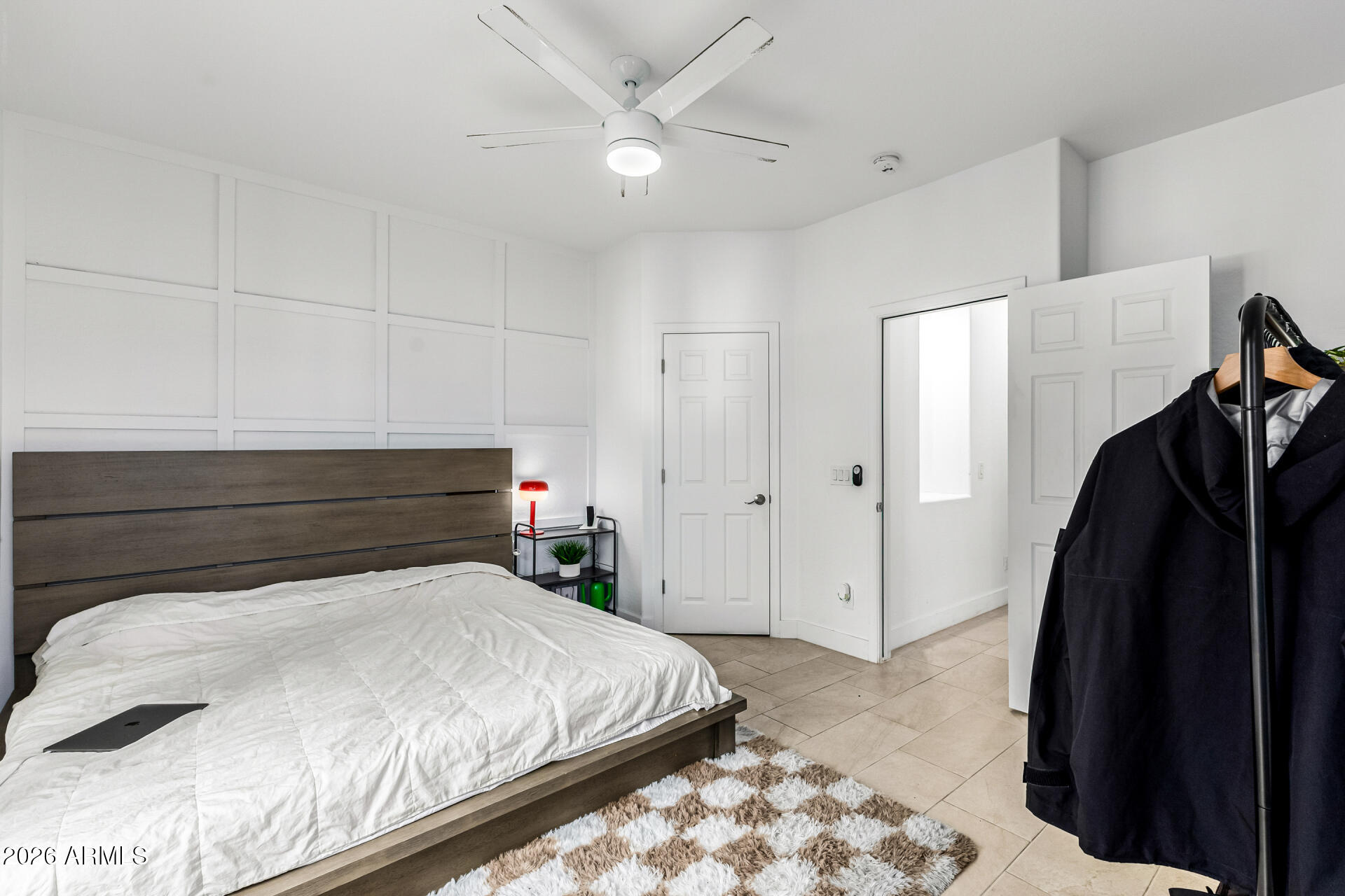 1718 West Colter Street, Unit 115 Phoenix, AZ 85015 - Photo 13 of 26 a bedroom with a bed and a walk in closet