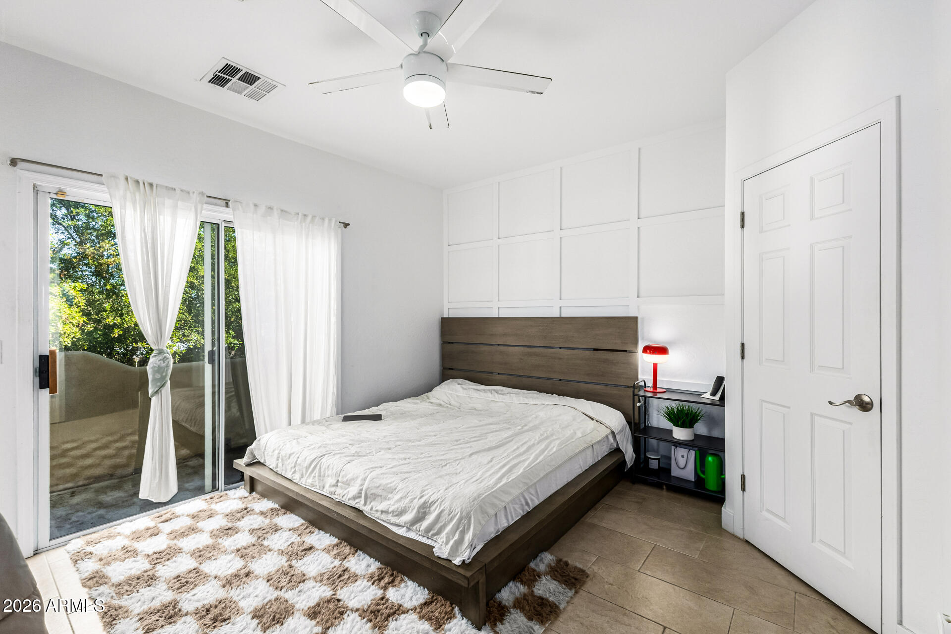 1718 West Colter Street, Unit 115 Phoenix, AZ 85015 - Photo 14 of 26 a bedroom with a bed and a chandelier