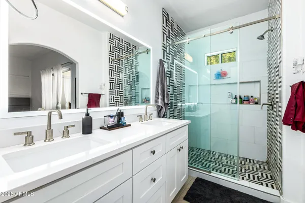 a bathroom with a sink and a mirror