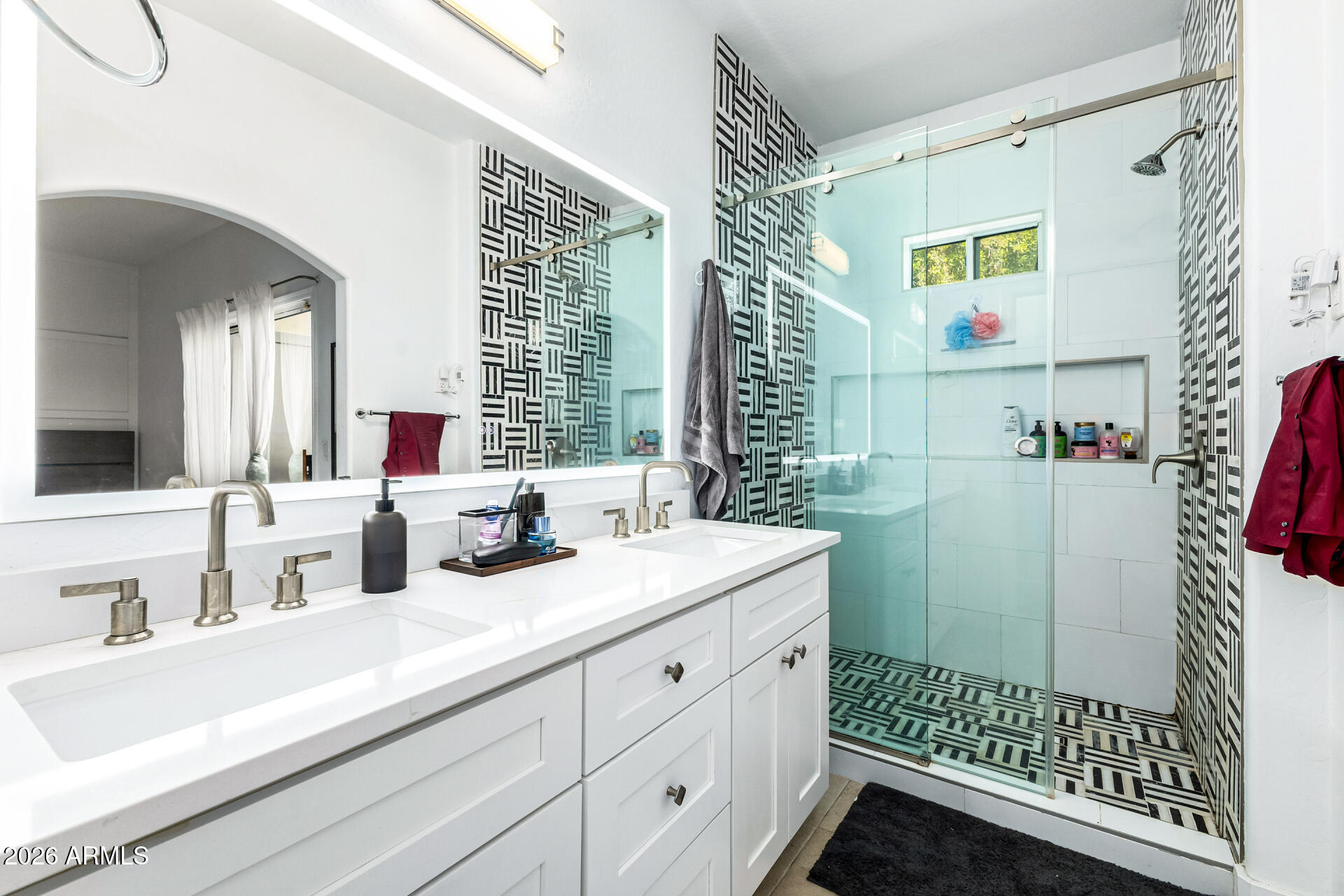 1718 West Colter Street, Unit 115 Phoenix, AZ 85015 - Photo 15 of 26 a bathroom with a sink and a mirror
