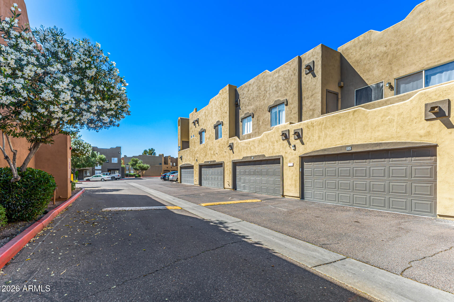 1718 West Colter Street, Unit 115 Phoenix, AZ 85015 - Photo 26 of 26 a view of a house with a street
