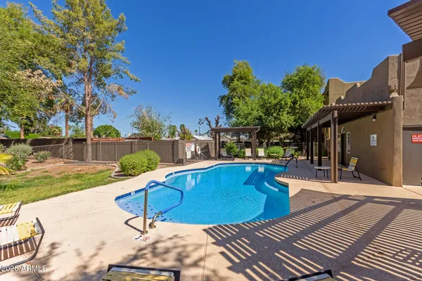 a view of a swimming pool with a patio