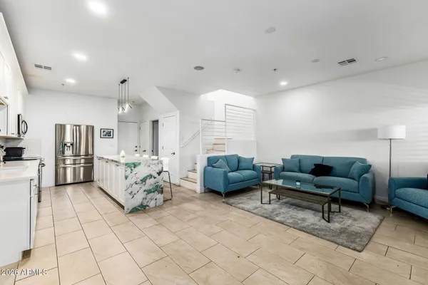 a living room with furniture and a couch