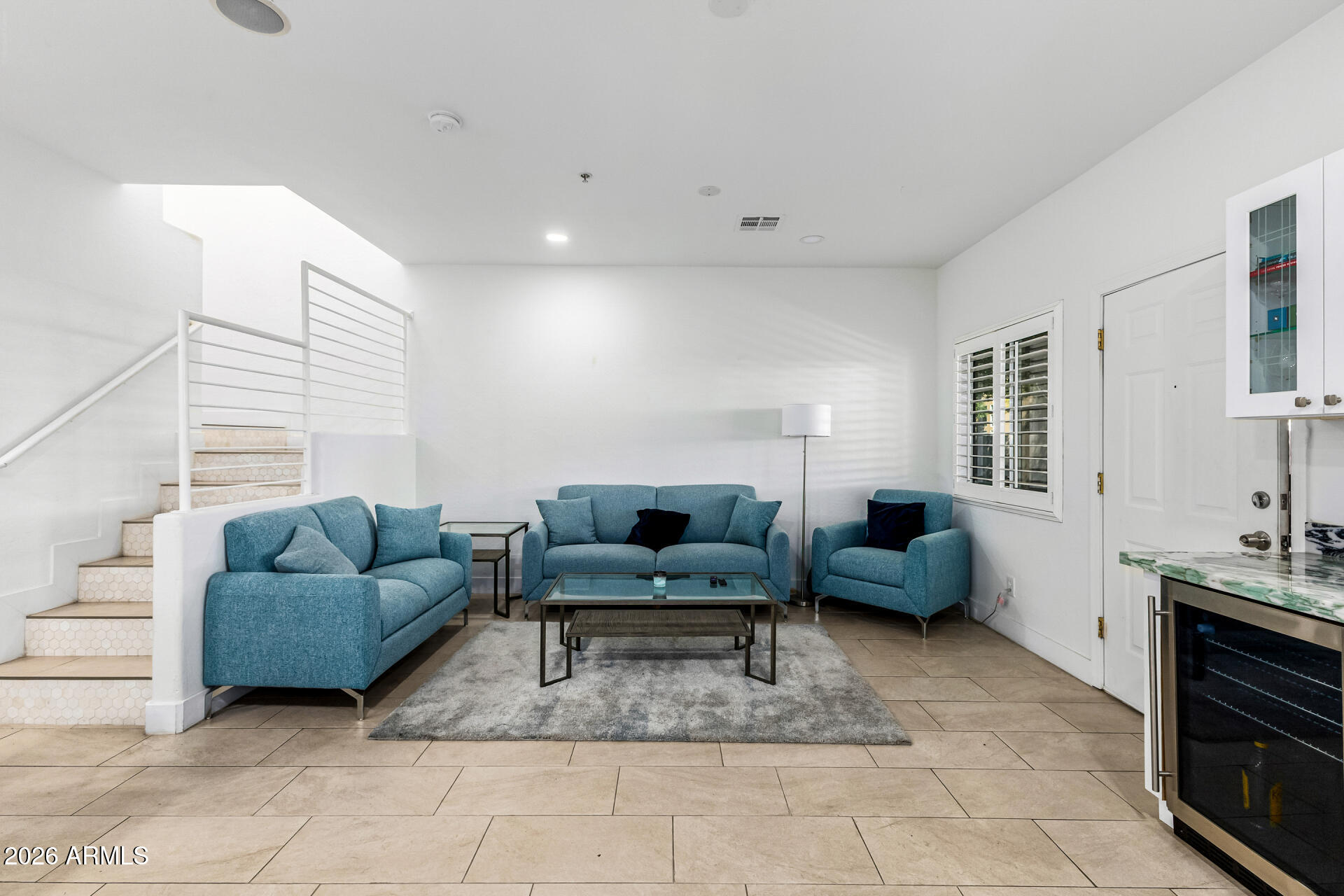 1718 West Colter Street, Unit 115 Phoenix, AZ 85015 - Photo 7 of 26 a living room with furniture and a couch