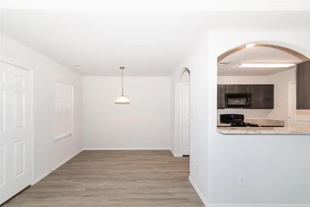 a view of a kitchen from the hallway