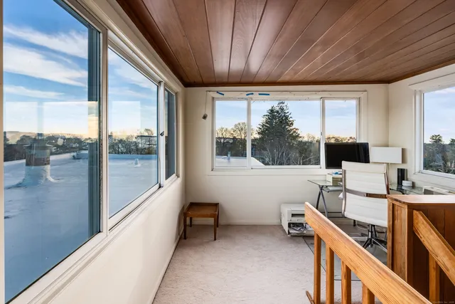 a hallway with a elevator and a workspace