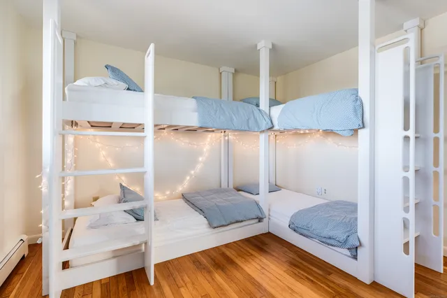 a bathroom with a shower sink vanity and mirror