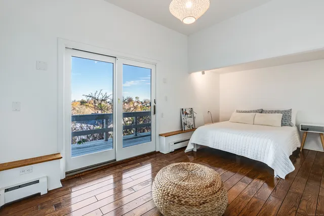 a living room with lots of furniture and a flat screen tv