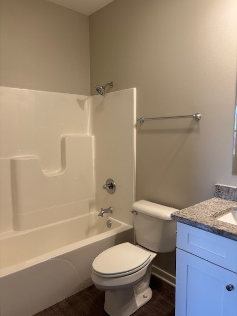 608 Anjali Court, Unit L Sycamore, IL 60178 - Photo 11 of 26 a white toilet sitting next to a bath tub