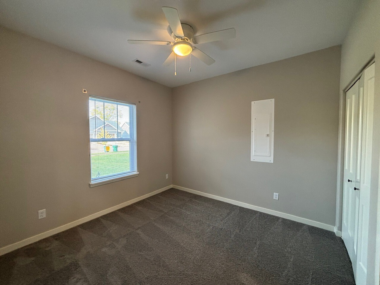 608 Anjali Court, Unit L Sycamore, IL 60178 - Photo 13 of 26 a view of an empty room with a window