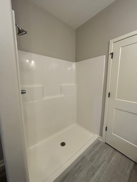 608 Anjali Court, Unit L Sycamore, IL 60178 - Photo 22 of 26 a bathroom with a tub