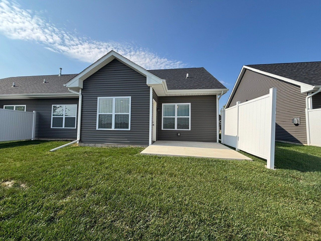 608 Anjali Court, Unit L Sycamore, IL 60178 - Photo 25 of 26 a view of a house with a yard