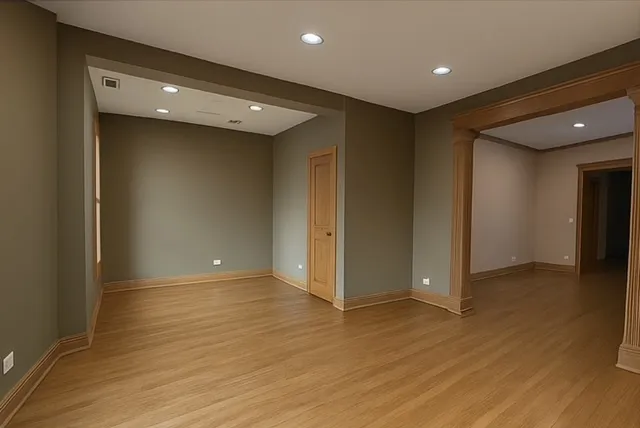 a view of hallway with wooden floor