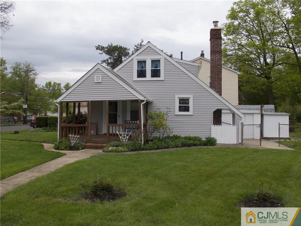 1707 Holly Road North Brunswick, NJ 08902 - Photo 1 of 21 a front view of a house with a yard and trees