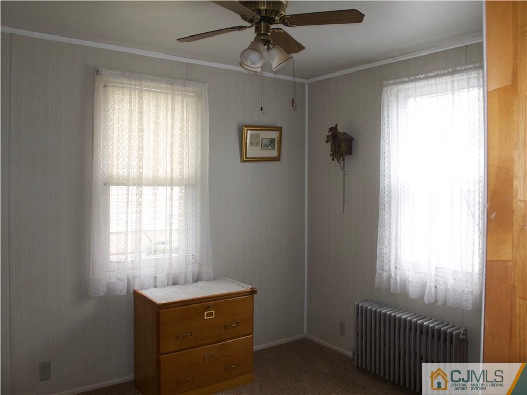 1707 Holly Road North Brunswick, NJ 08902 - Photo 12 of 21 a room that has a window and a dresser