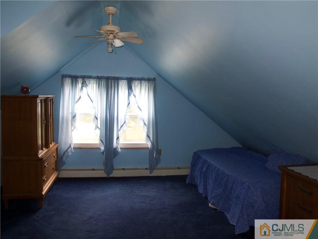 1707 Holly Road North Brunswick, NJ 08902 - Photo 13 of 21 a room with window and ceiling fan