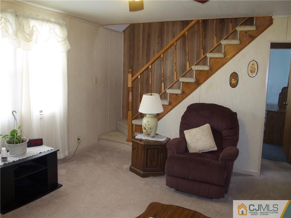 1707 Holly Road North Brunswick, NJ 08902 - Photo 8 of 21 a living room with furniture and wooden floor