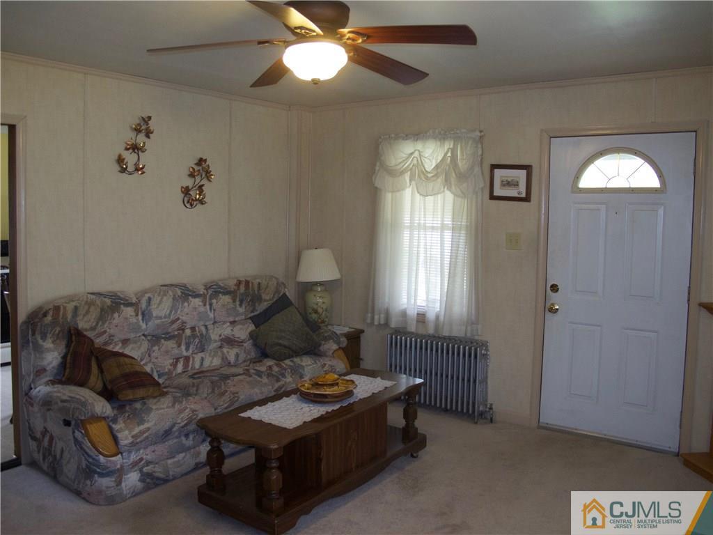 1707 Holly Road North Brunswick, NJ 08902 - Photo 9 of 21 a living room with furniture and a window
