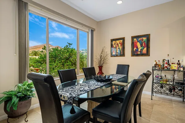 a kitchen with stainless steel appliances granite countertop a refrigerator stove top oven and sink