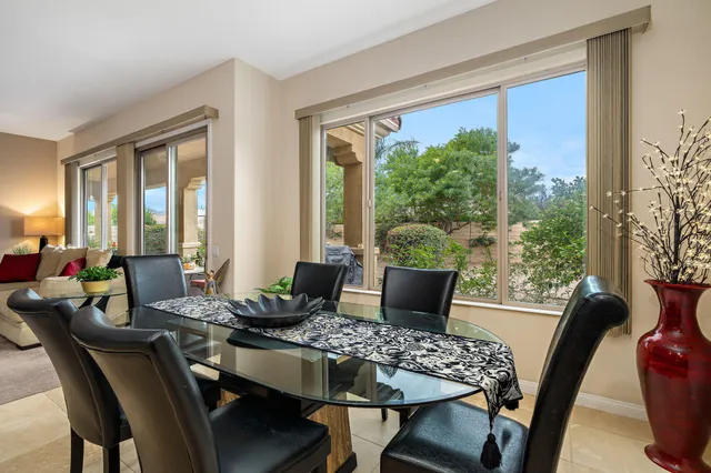 a kitchen with granite countertop sink stove and cabinets