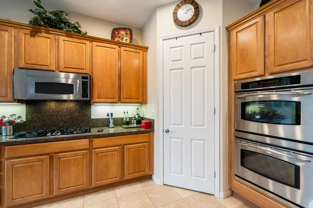 a backyard of a house with outdoor seating