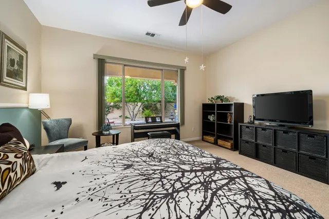 a white bath tub sitting next to a white sink