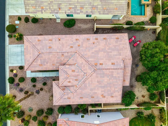 a view of a house with a flower garden