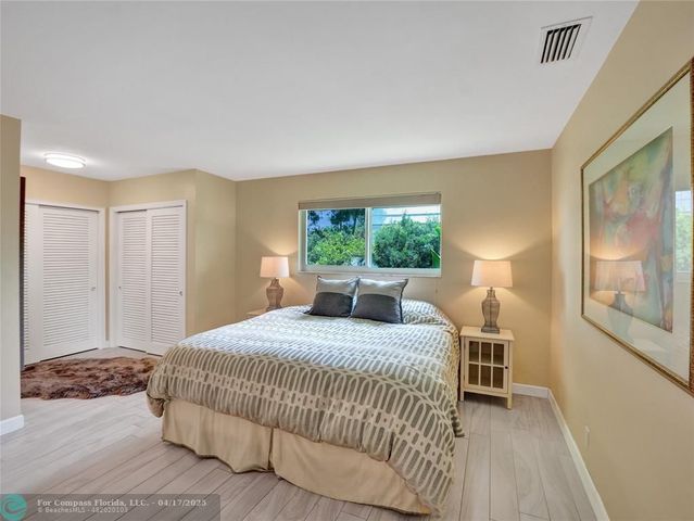 a bathroom with a double vanity sink and mirror