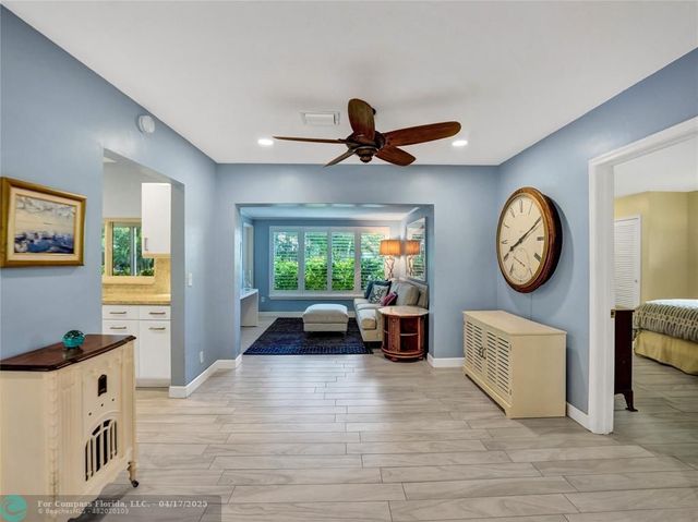 a very nice looking room with kitchen island furniture and a large window