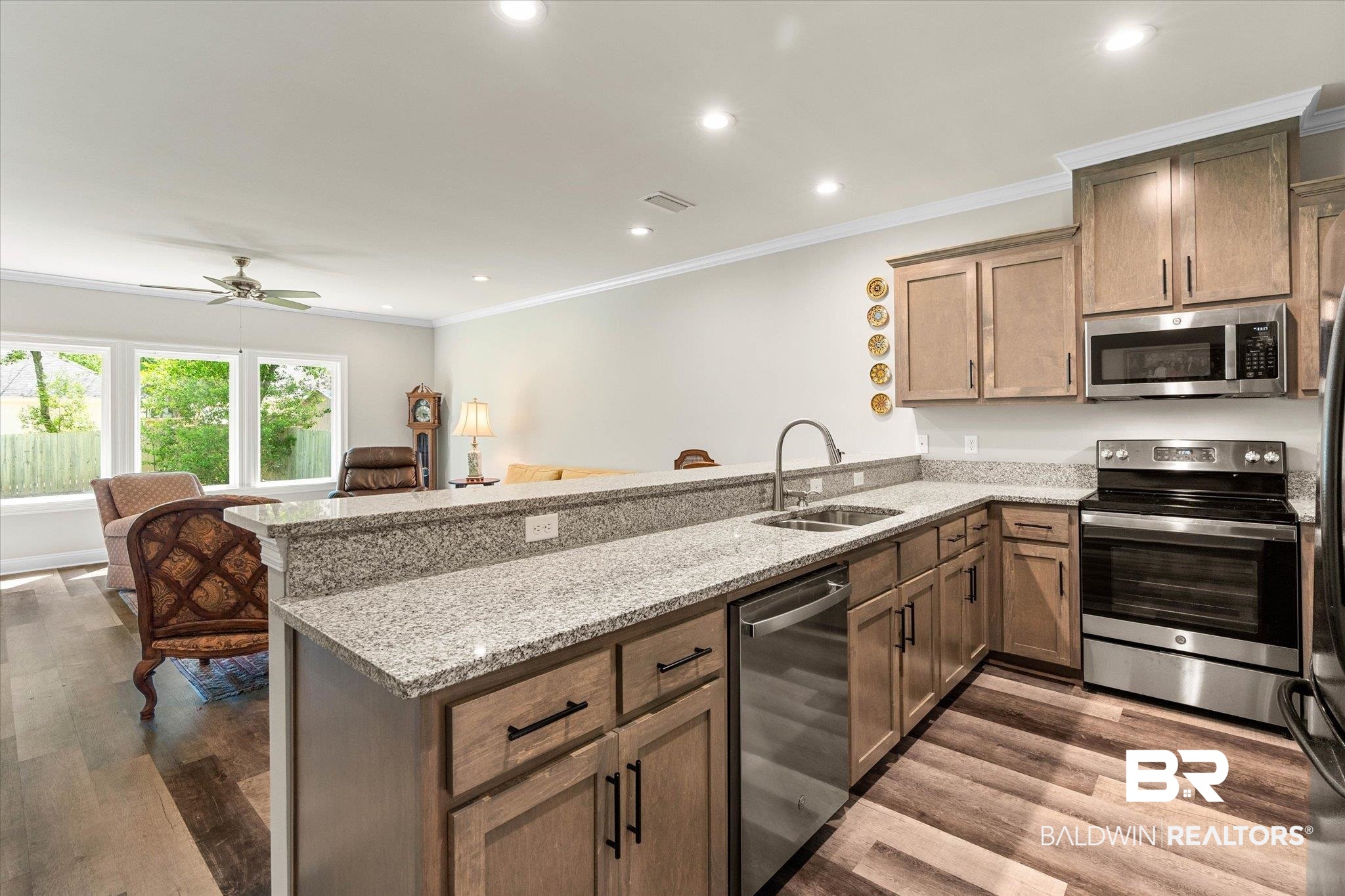 1101 Pinemont Drive Mobile, AL 36609 - Photo 7 of 18 Kitchen with a peninsula, a sink, recessed lighting, and appliances with stainless steel finishes