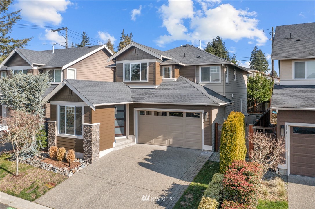 19208 101st Place Southeast Renton, WA 98055 - Photo 1 of 36 a front view of a house with garden