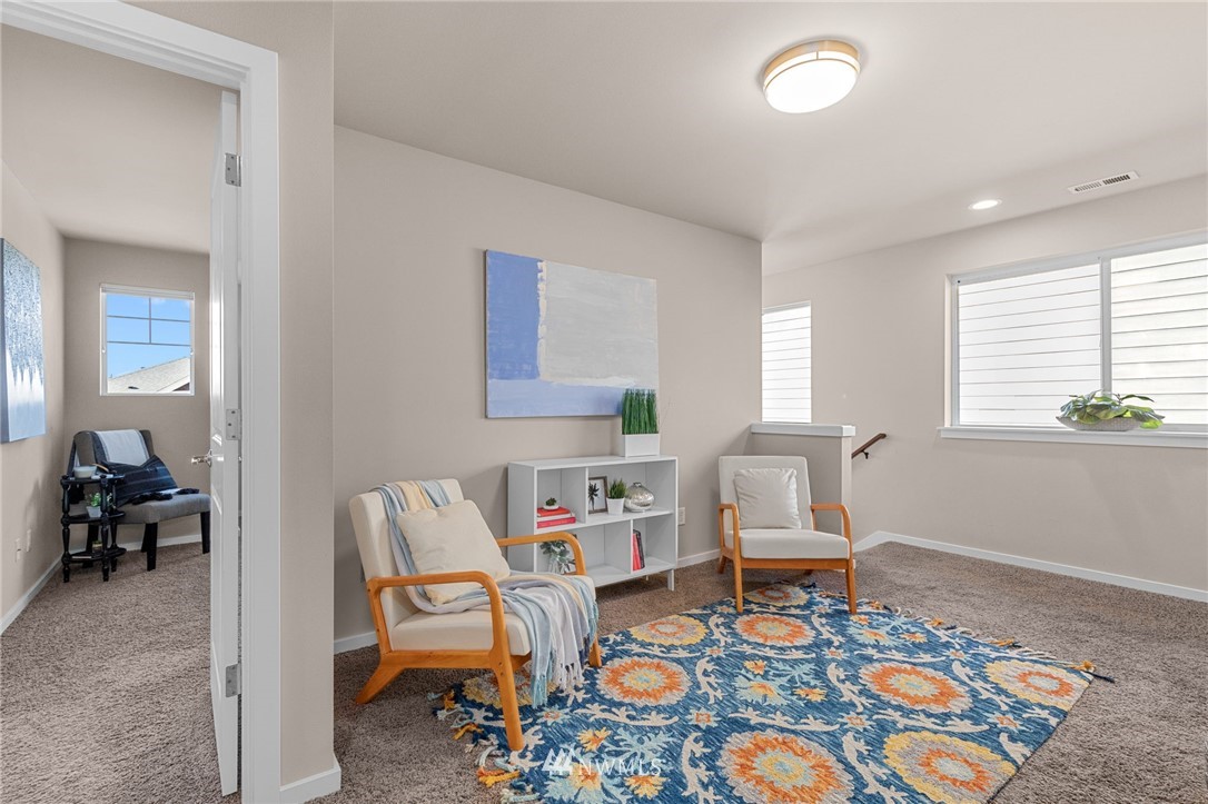 19208 101st Place Southeast Renton, WA 98055 - Photo 18 of 36 a living room with furniture and a window