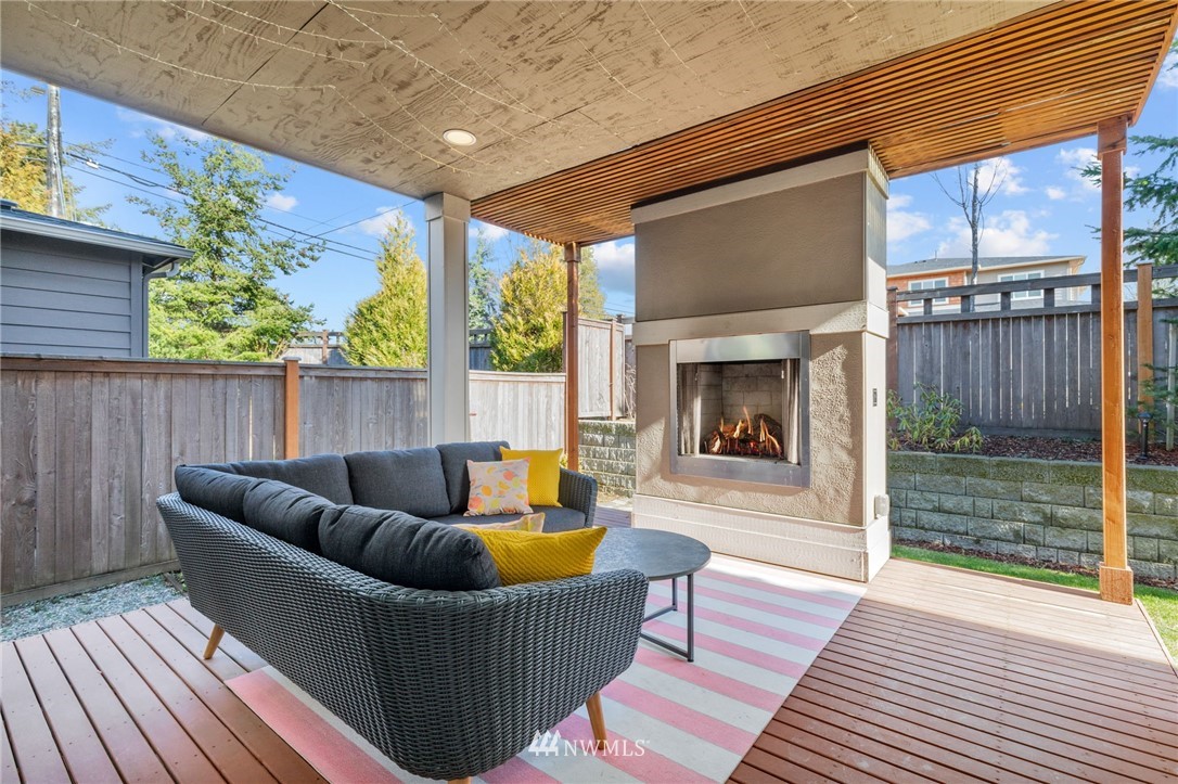 19208 101st Place Southeast Renton, WA 98055 - Photo 29 of 36 a living room with furniture a fireplace and a wooden floor