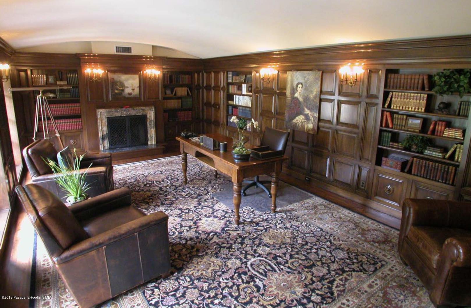 2288 Villa Heights Road Pasadena, CA 91107 - Photo 25 of 78 a living room with furniture a lamp and a fireplace