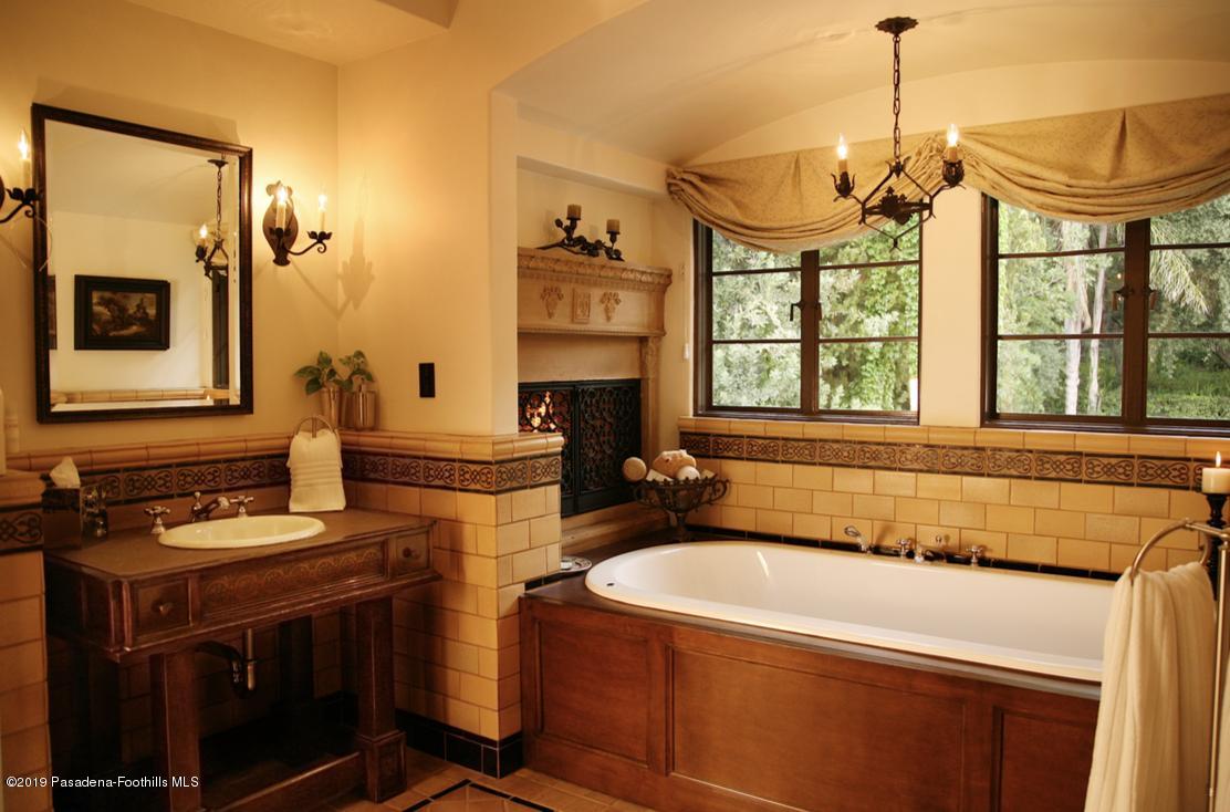 2288 Villa Heights Road Pasadena, CA 91107 - Photo 31 of 78 a kitchen with a stove a sink and wooden floor