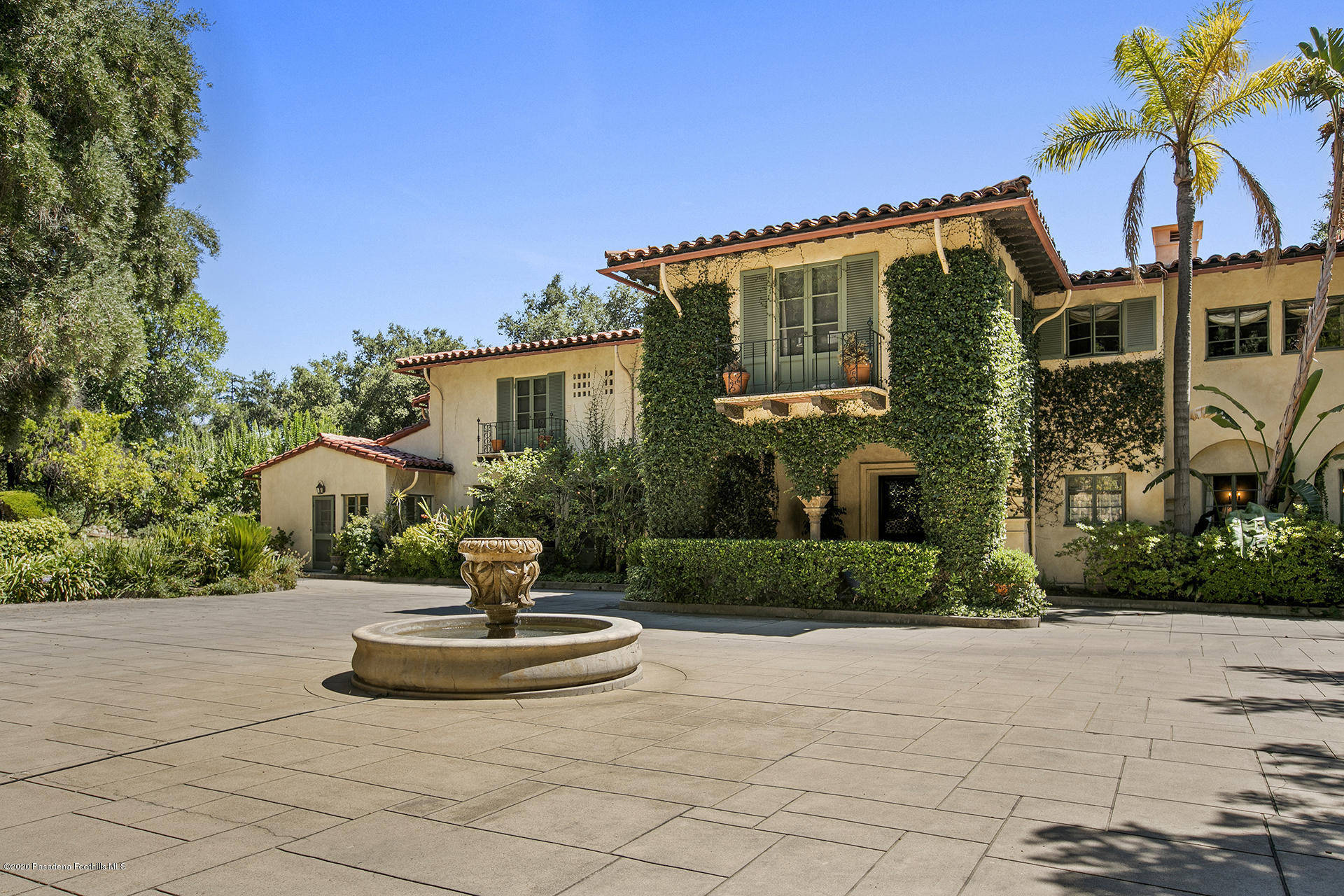 2288 Villa Heights Road Pasadena, CA 91107 - Photo 5 of 78 a front view of a house with a garden and fountain