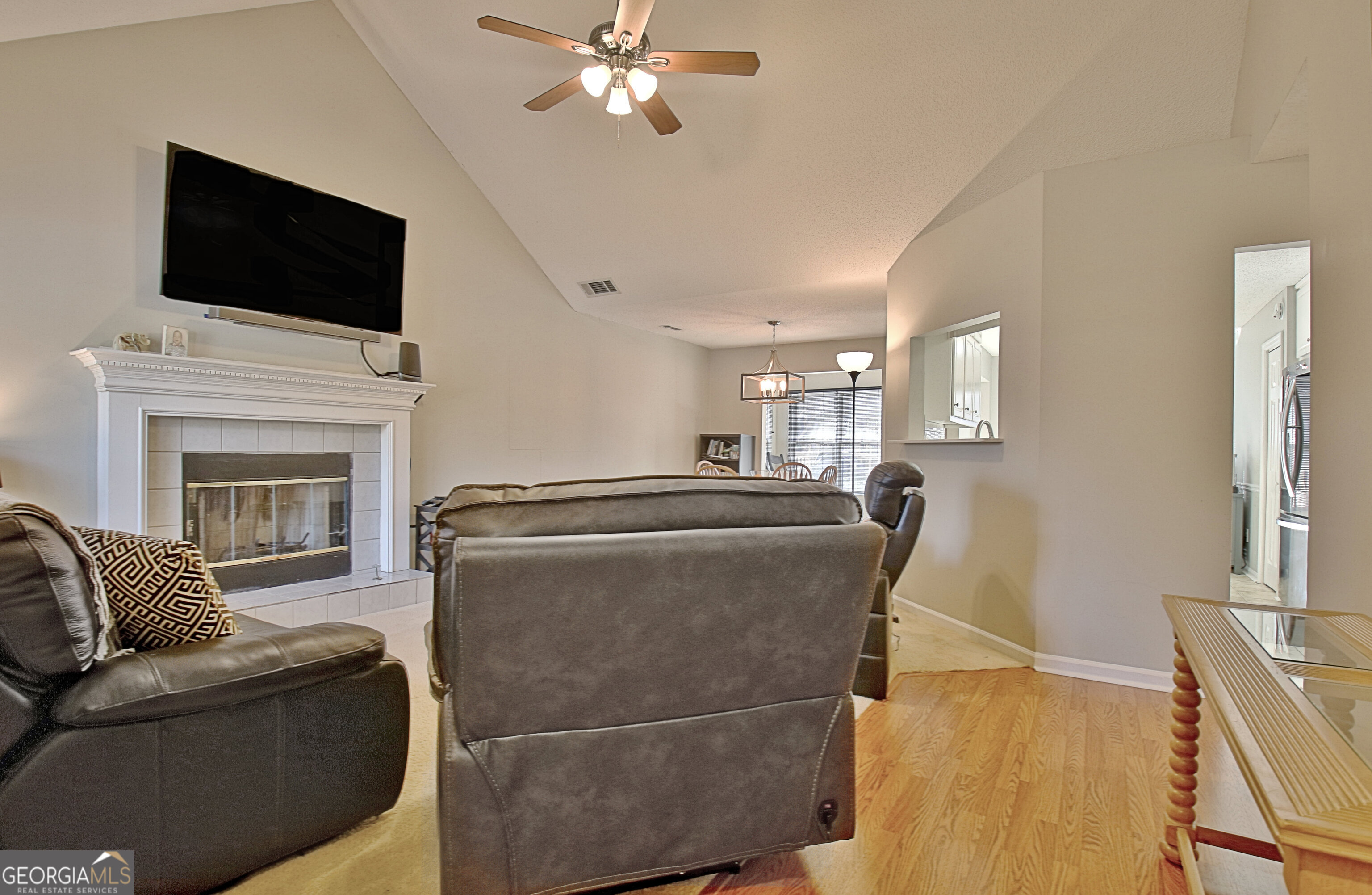 104 Blue Ridge Drive Newnan, GA 30265 - Photo 11 of 60 a living room with furniture and a flat screen tv