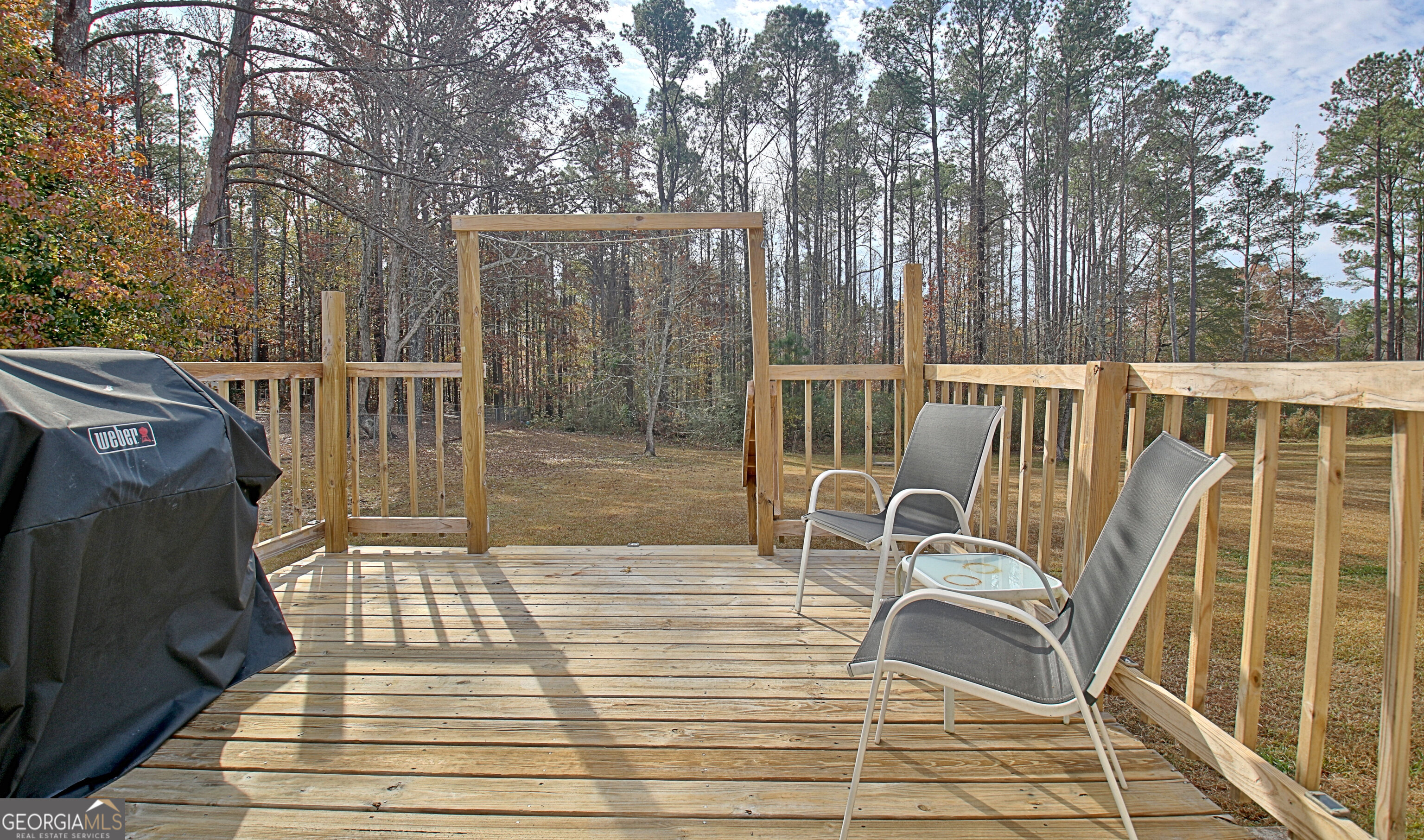 104 Blue Ridge Drive Newnan, GA 30265 - Photo 18 of 60 a view of balcony with wooden floor and fence