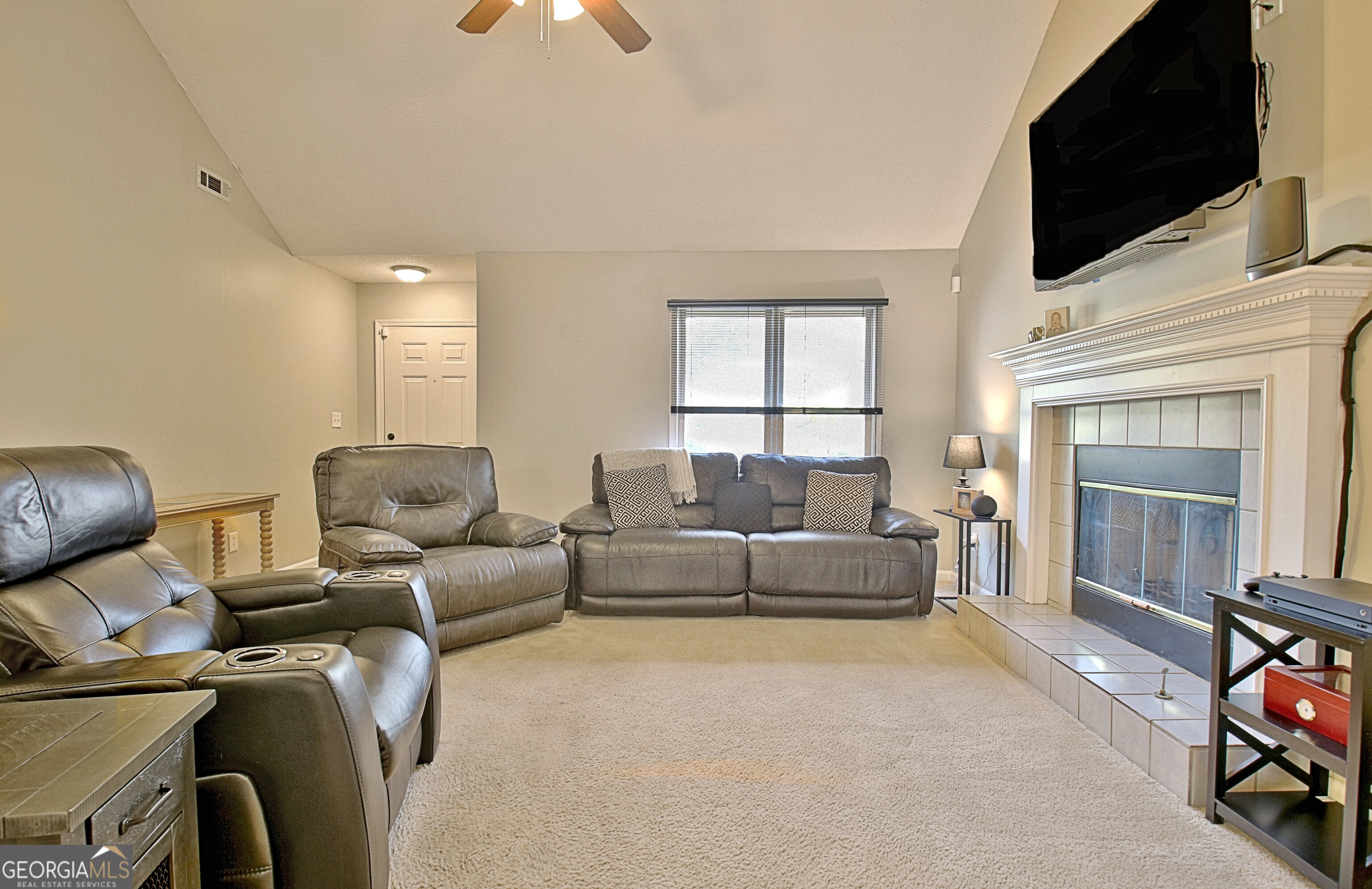 104 Blue Ridge Drive Newnan, GA 30265 - Photo 2 of 60 a living room with furniture and a flat screen tv