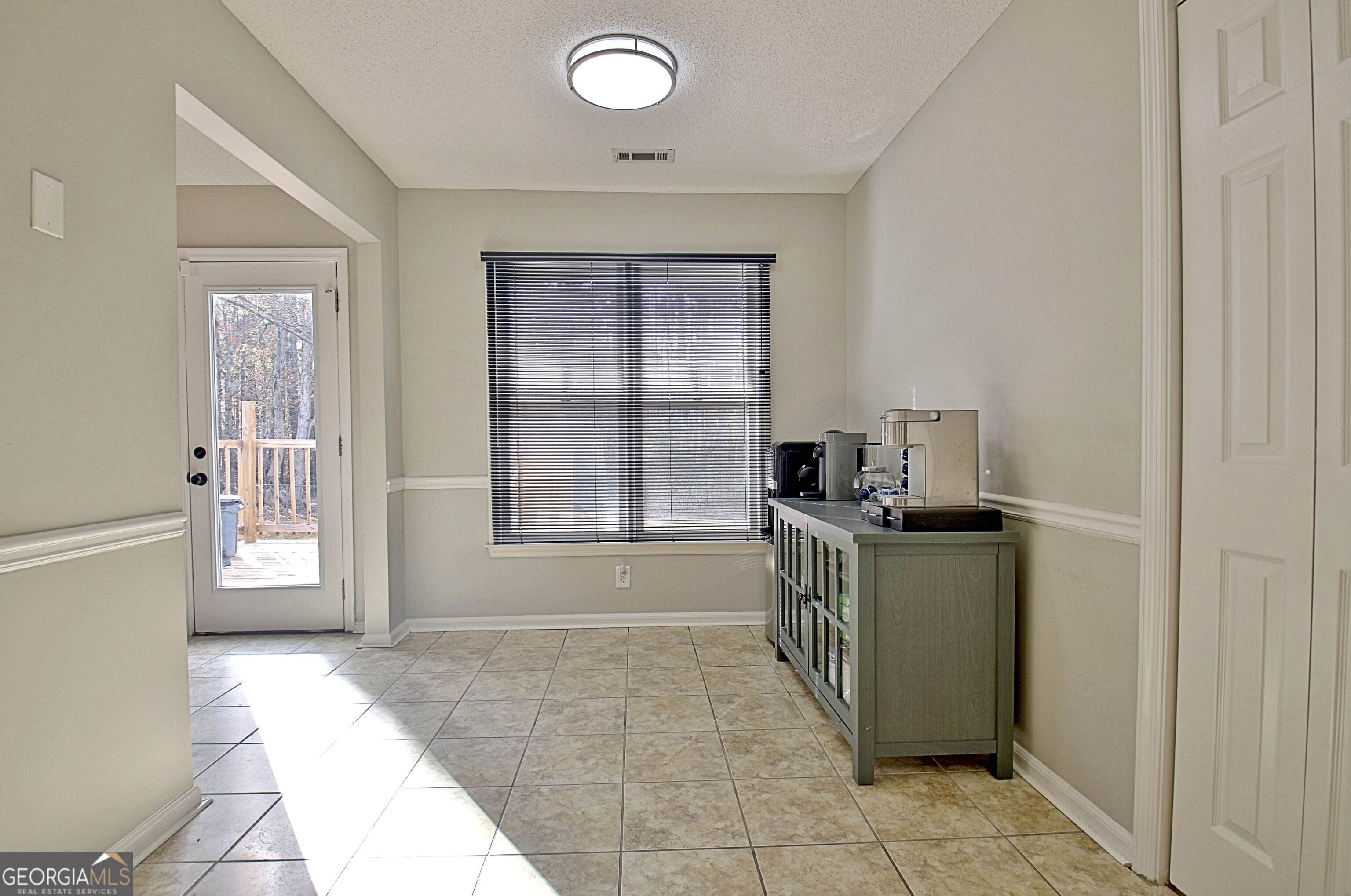 104 Blue Ridge Drive Newnan, GA 30265 - Photo 25 of 60 a room that has a bed and a window in it