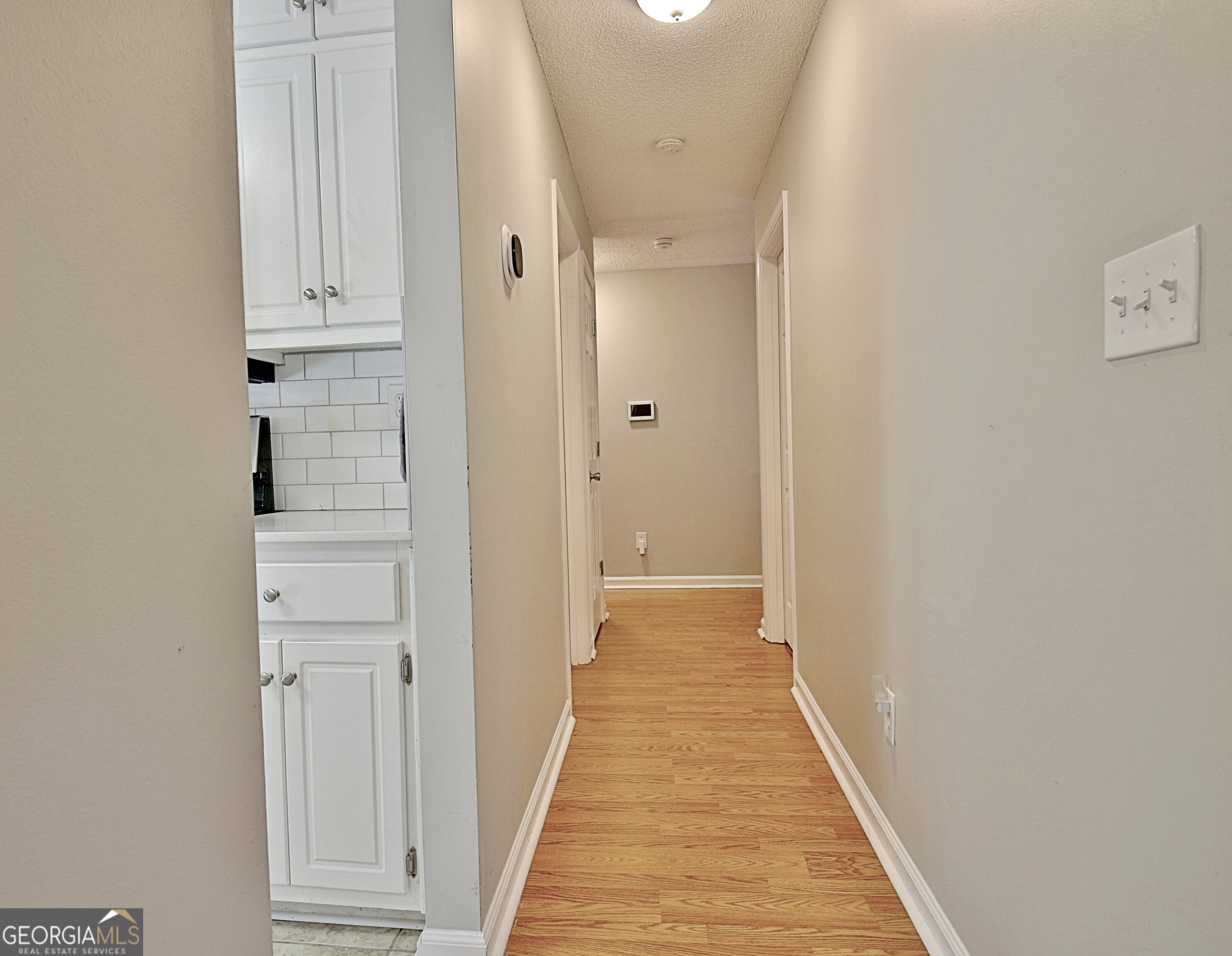 104 Blue Ridge Drive Newnan, GA 30265 - Photo 29 of 60 a view of a hallway with wooden floor and entryway