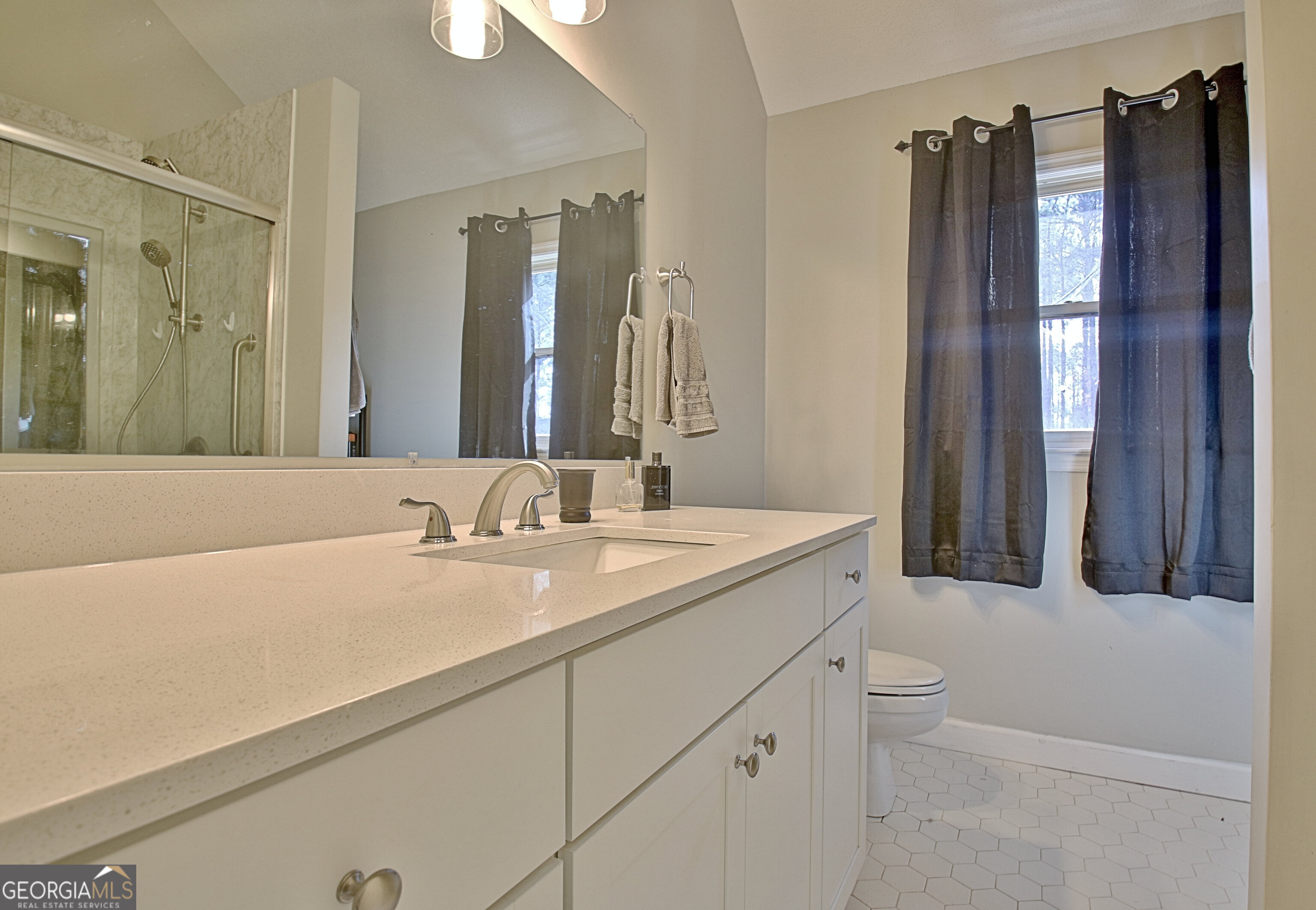 104 Blue Ridge Drive Newnan, GA 30265 - Photo 35 of 60 a bathroom with a granite countertop sink and a mirror
