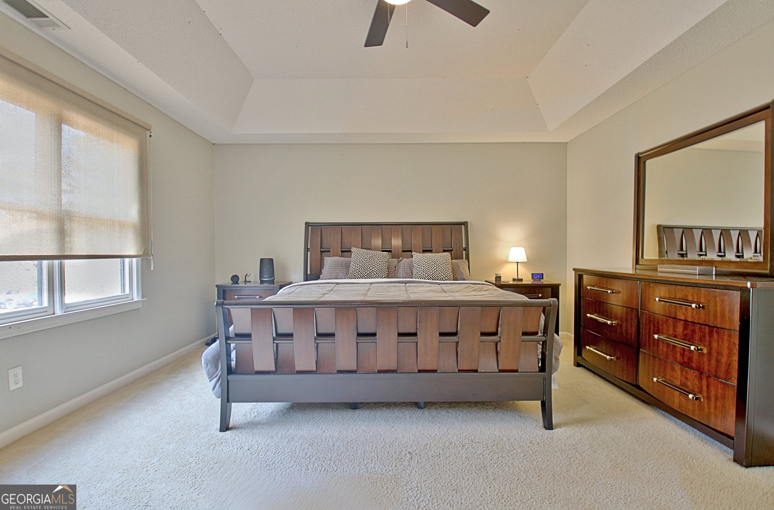 104 Blue Ridge Drive Newnan, GA 30265 - Photo 39 of 60 a bed sitting in a bedroom next to a window