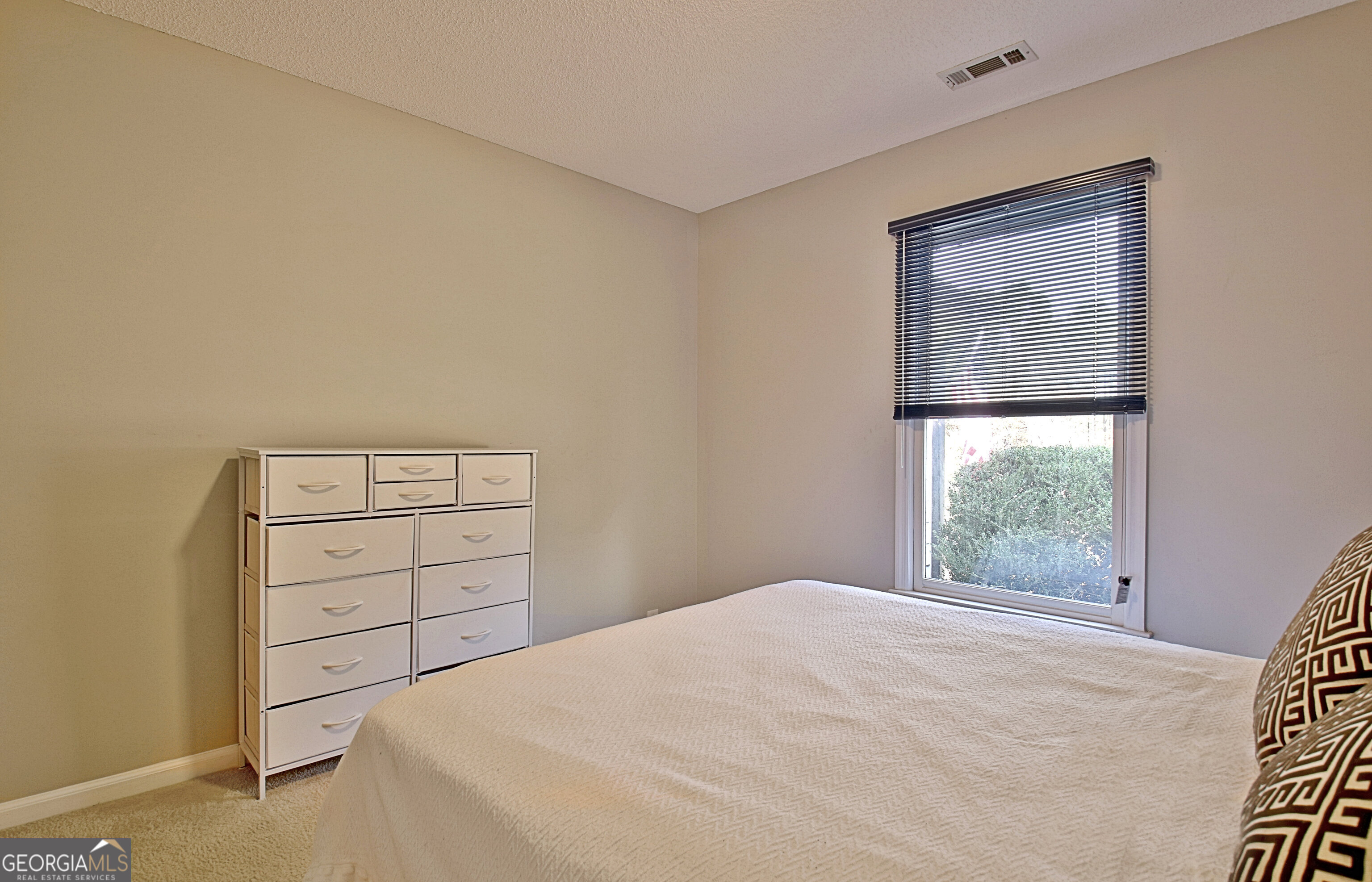 104 Blue Ridge Drive Newnan, GA 30265 - Photo 41 of 60 a bedroom with a bed and a window