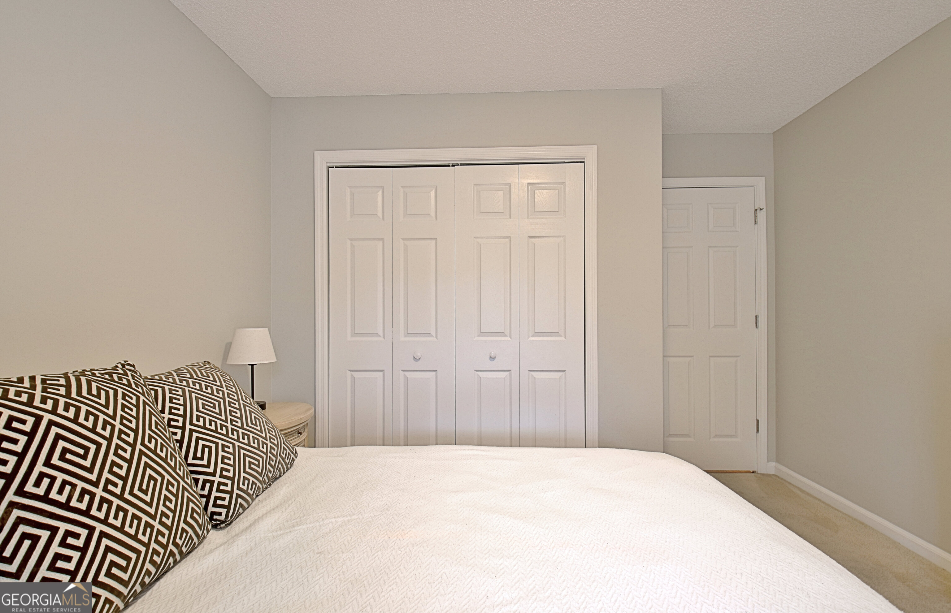 104 Blue Ridge Drive Newnan, GA 30265 - Photo 42 of 60 a bedroom with a bed and wooden floor