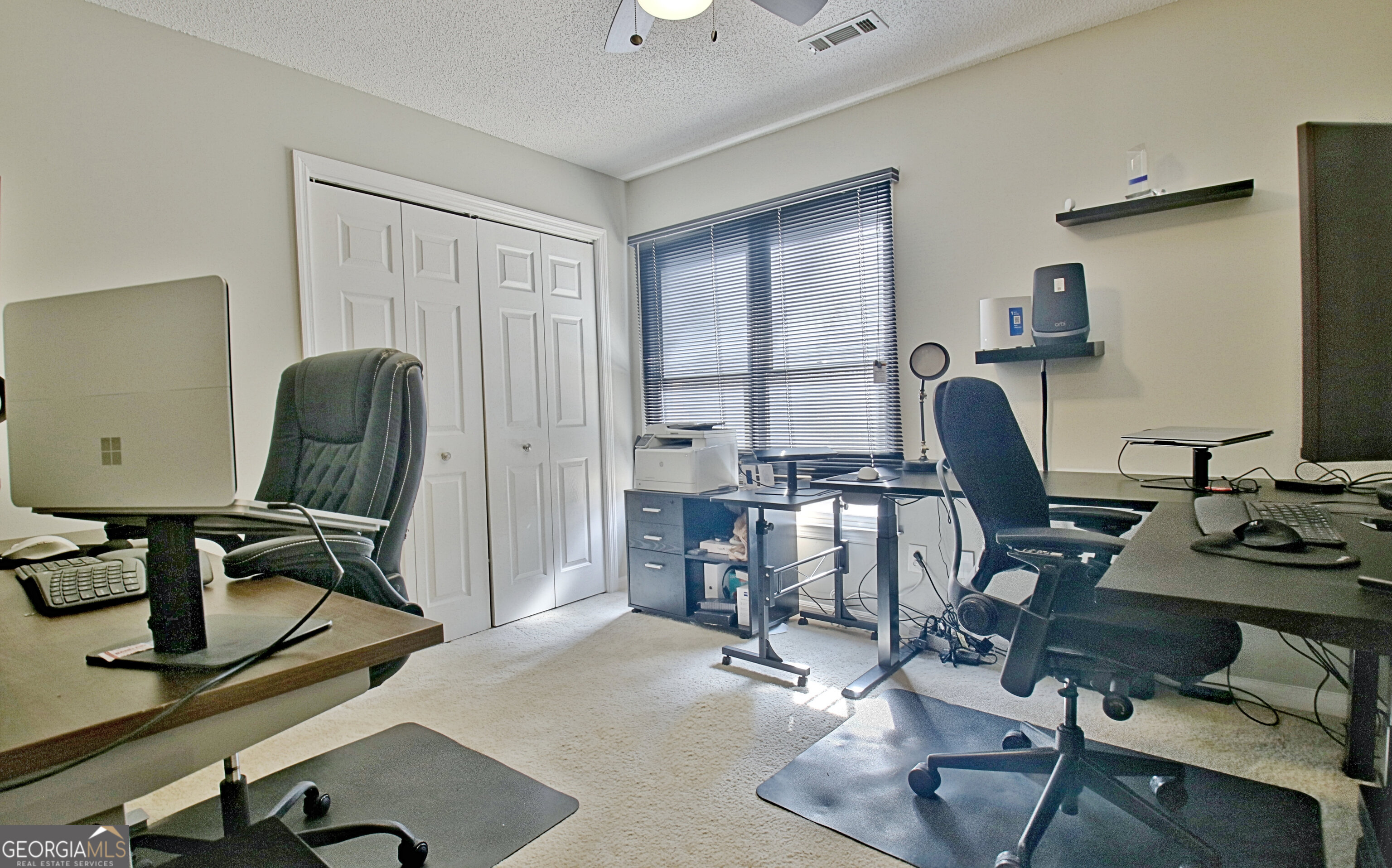 104 Blue Ridge Drive Newnan, GA 30265 - Photo 47 of 60 a view of a workspace with furniture and a window
