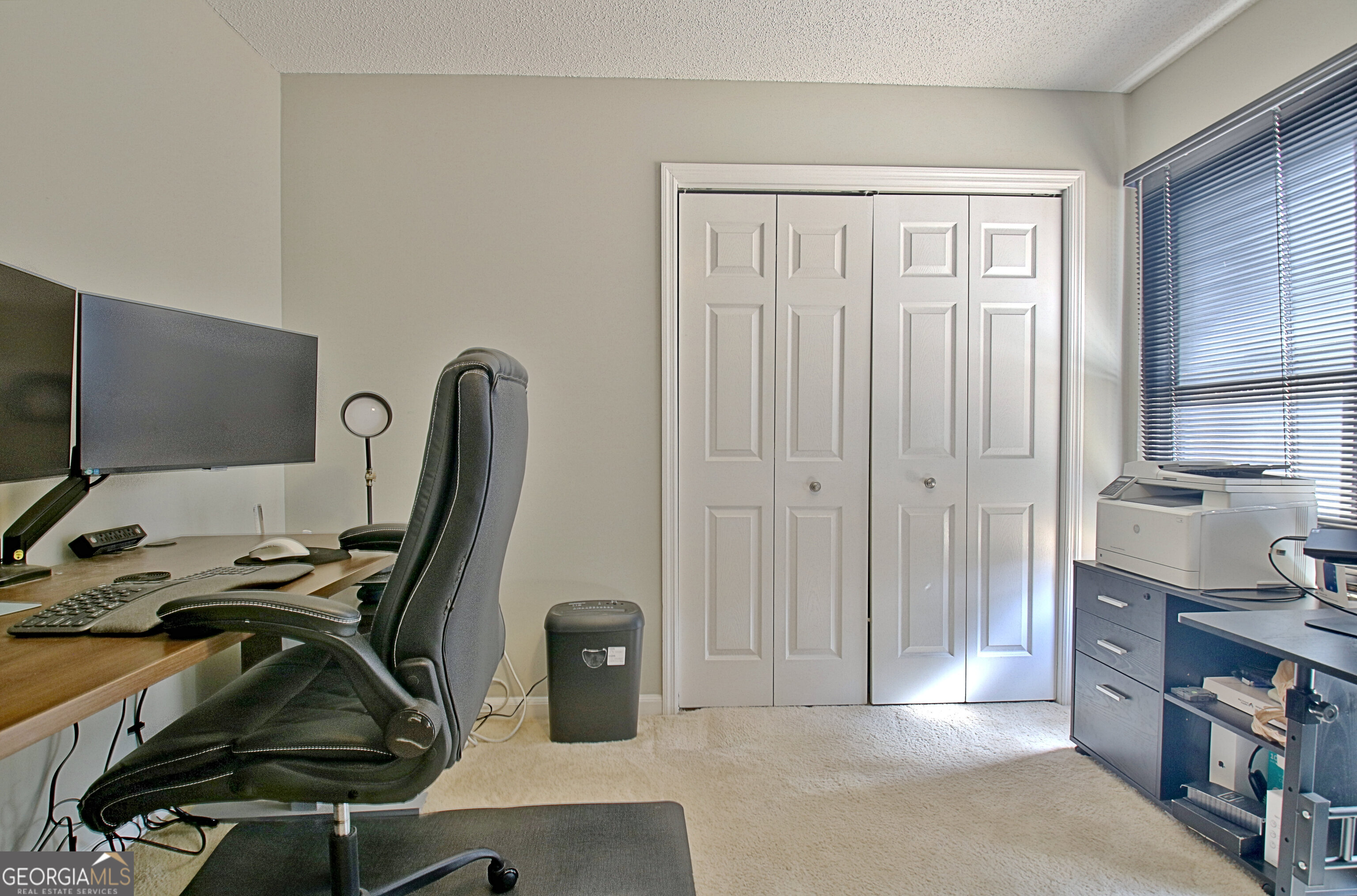 104 Blue Ridge Drive Newnan, GA 30265 - Photo 48 of 60 a view of a workspace with furniture and a window