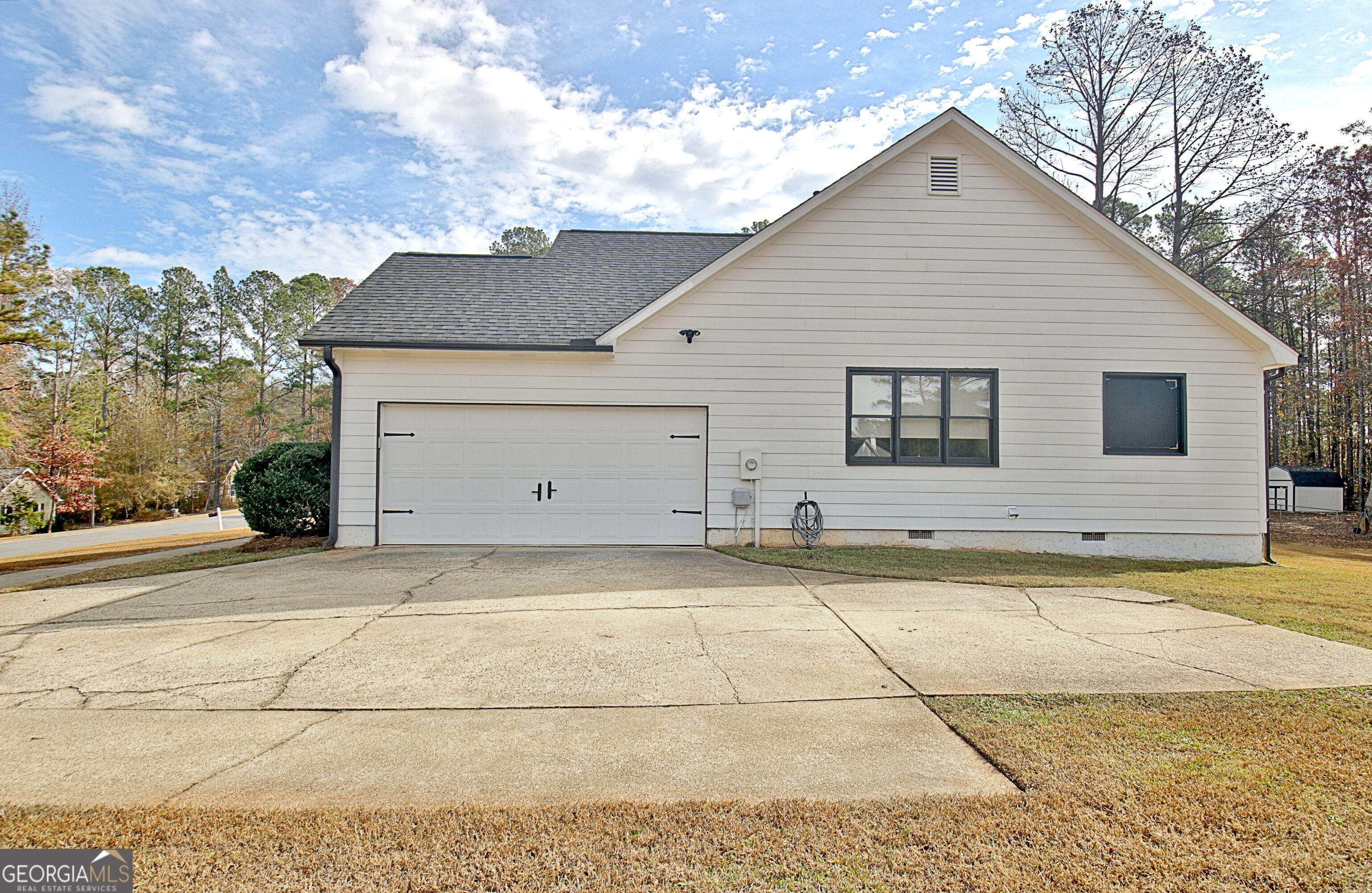 104 Blue Ridge Drive Newnan, GA 30265 - Photo 8 of 60 a view of a white house with a outdoor space