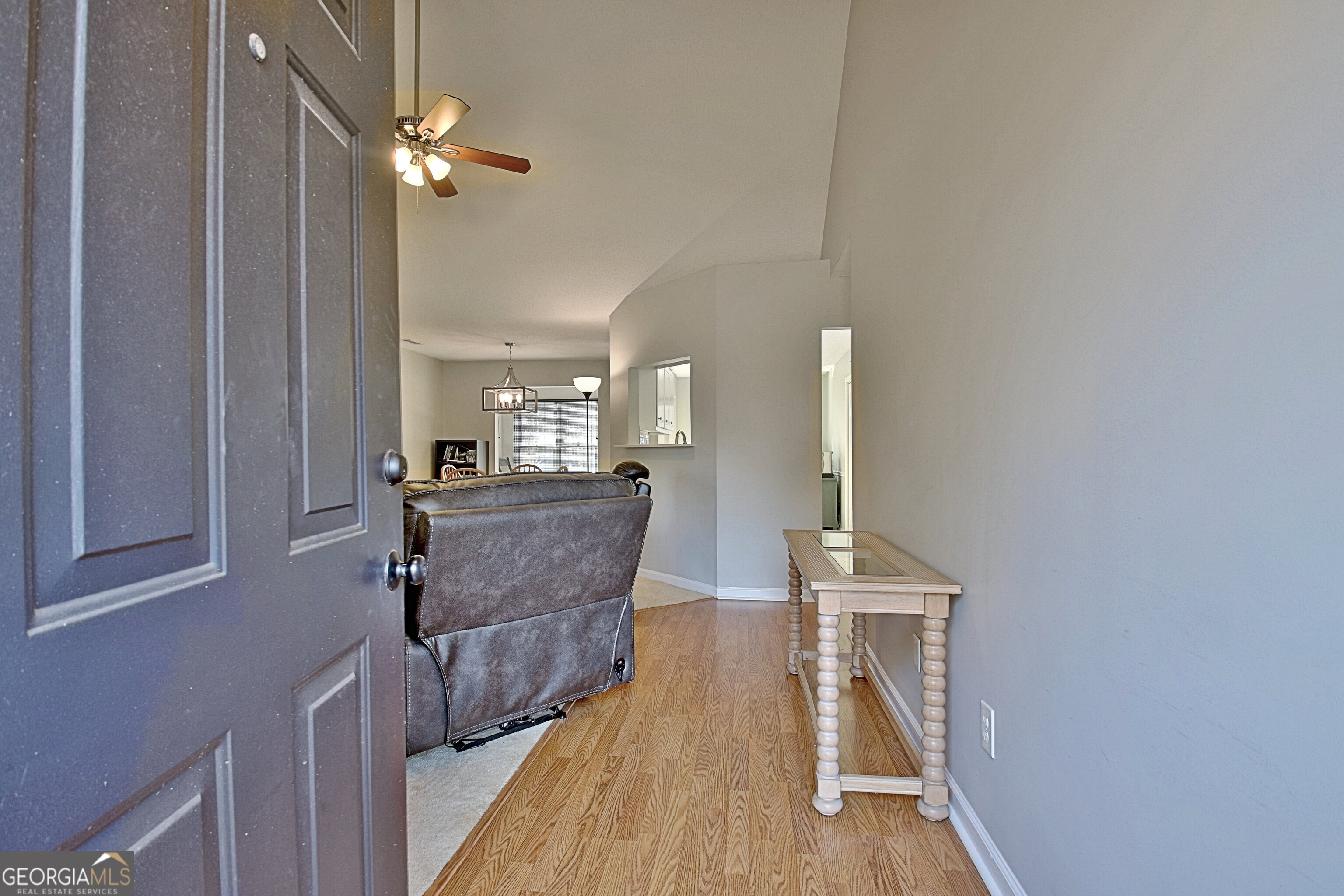 104 Blue Ridge Drive Newnan, GA 30265 - Photo 10 of 60 a view of a hallway with wooden floor and staircase